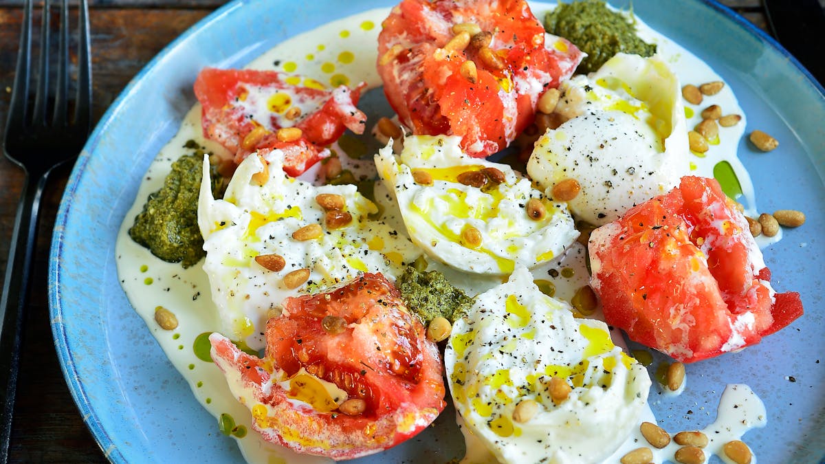 Burrata with tomato, cream and pesto